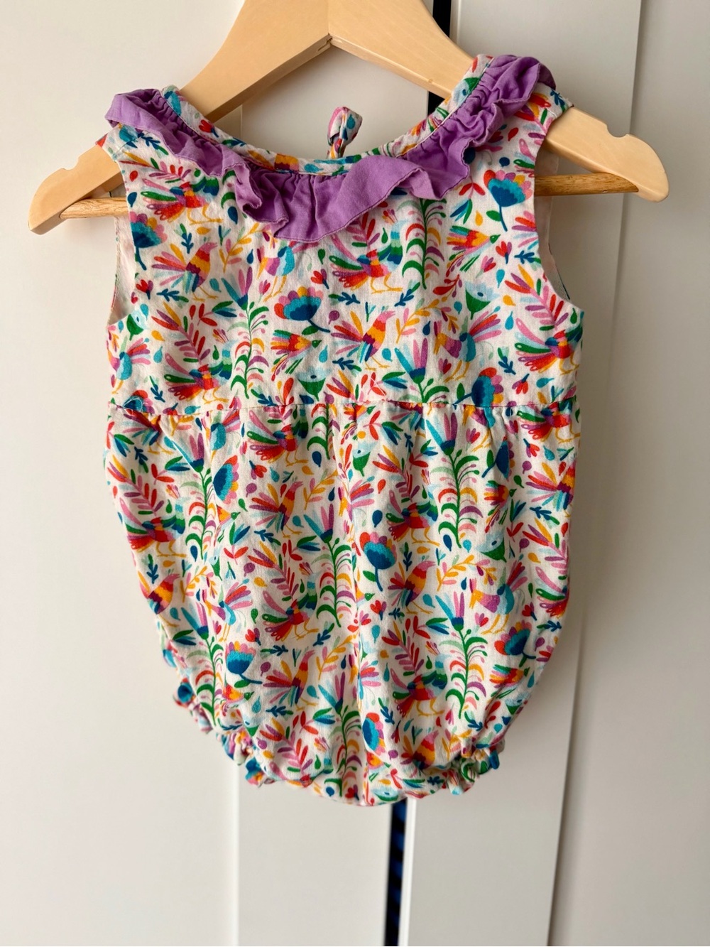 Smockingbird  ruffle peacock print bubble romper